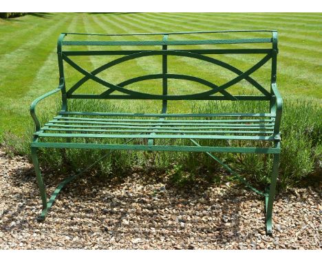 A painted wrought iron garden bench in Regency style, 19th century, of slatted construction, the backrest wrought with semi c