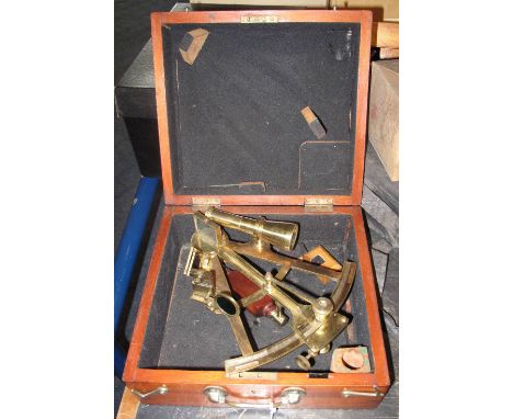 Unnamed polished brass sextant with silvered scale and mahogany handle in fitted mahogany case.