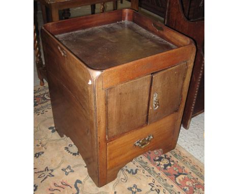 18th Century mahogany night table having tray top with hand slots over two blind panelled cupboard doors, pull out drawer bel