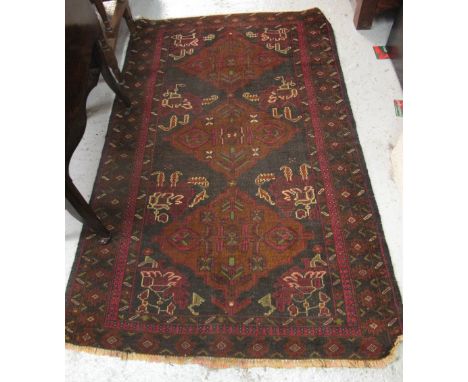 Persian antique rug on a navy ground with geometric and other designs.  103 x 169cm