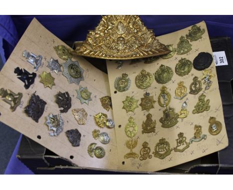 Collection of assorted military regimental original and reproduction cap badges to include: helmet plate, Middlesex RGA Volun