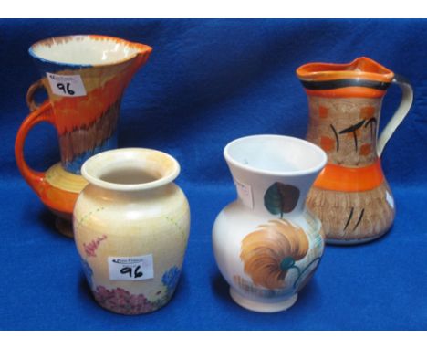 Two Radford pottery floral baluster vases, a Myott and son baluster shaped pottery jug and a Wade heath brightly coloured art