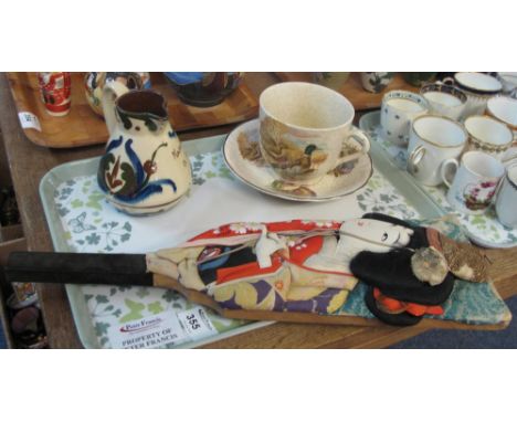 Oriental wooden and fabric figural paddle together with Torquay ware 'Make the Best of a Bad Bargain' jug together with Royal