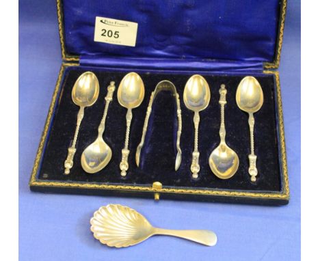 Cased set of silver apostle spoons, Sheffield hallmarks together with silver shell design tea caddy spoon.