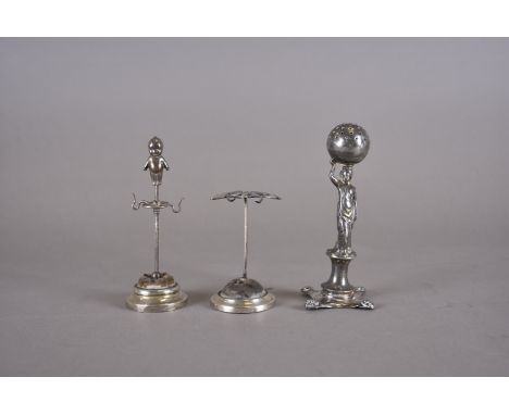 An Edward VII silver novelty hatpin holder, circular grey base, silver rim, single stem surmounted by silver and mother of pe