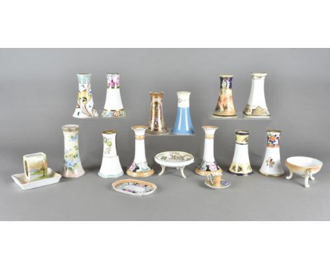A collection Noritake porcelain hatpin holders, including footed bowls, matchbox holders, chambersticks etc, all decorated wi