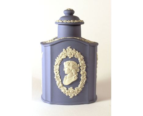A Wedgwood Jasperware tea caddy and cover of traditional form, typically decorated with floral wreaths and swags, h. 16 cm CO