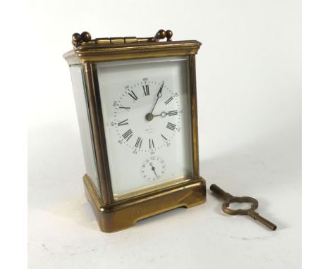 A 19th century French brass and five glass carriage clock with alarm and lever escapement, the enamelled face with Roman and 