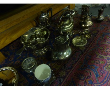 A large collection of 19th century and later silver plated items including a spirit kettle, coffee pot, condiment stand, flat