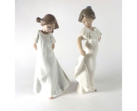 Two Nao figures, each modelled as young girl wearing a white dress, max h. 22 cm (2) CONDITION REPORT: No obvious chips, crac