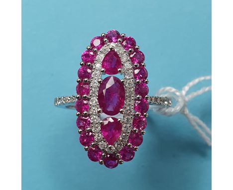 An 18ct gold, ruby and diamond flowerhead ring 