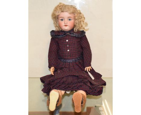 A Handwerck bisque head doll, with sleeping blue eyes, impressed Handwerck 4½, on a composition body, 64 cm 