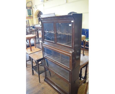 A Globe Wernicke style oak four section bookcase, 87 cm wide 