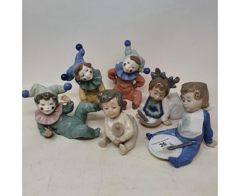 A set of six Nao figures, of children in various poses, with boxes (6) 