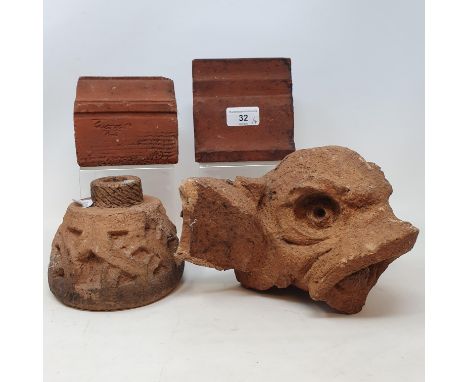 A Carters, Poole, earthenware mouding/brick, another similar, a grotesque beast tile and a section with a Celtic design, dama
