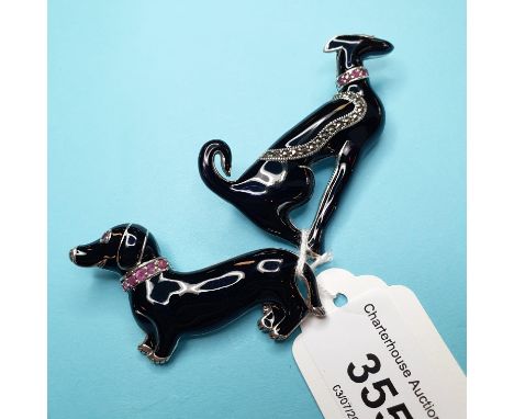An Art Deco style black enamel dog brooch, and another similar (2) 
