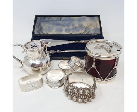 A silver cream jug, London 1909, four silver napkin rings, and other itemsReport JS   Drum silver plated glass in good order,
