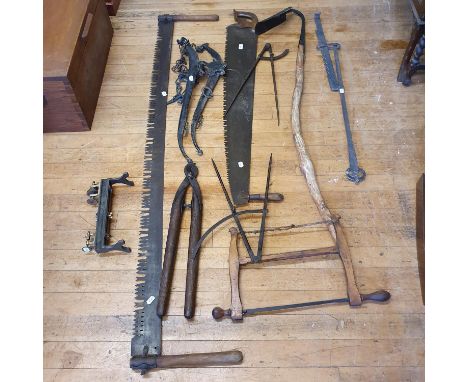 A two handled saw, other saws, tools and bygones (qty) 