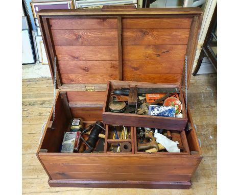 A carpenter's chest and various tools 