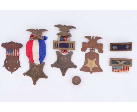 A quantity of US Grand Army of the Republic Civil War veterans' medals, rank bar suspender slides, a lapel badge and 33rd Nat