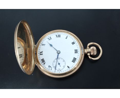 A George V 9 ct gold hunter pocket watch, having a 21 jewel Swiss, crown wind and set movement, an engine turned case bearing