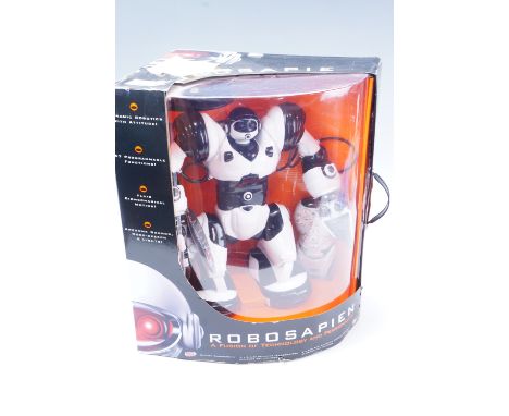 A boxed "Robosapien" remote control robot and controller