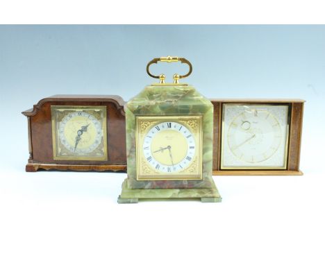Three mantle clocks, comprising a 1960s Elliott walnut clock, face marked 'Simpson - Yeates, Penrith', a 1960s Klenzle teak c