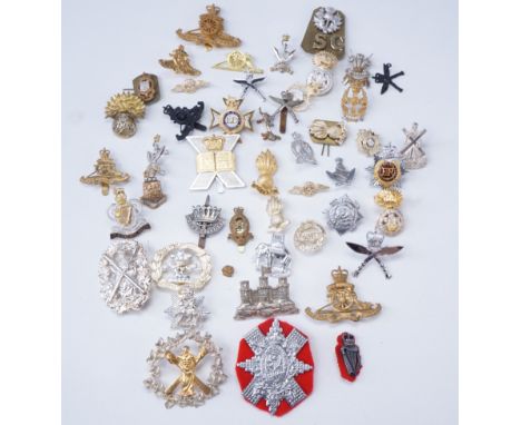 A quantity of largely post-1952 British army cap badges etc 