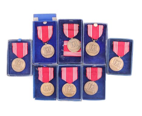 Four US Army Good Conduct Medals, boxed, and five others 