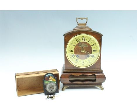 A 1980s Warmink walnut bracket clock, the double train movement striking on a bell, key present, and a modern Dutch brass and