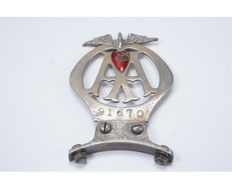 A 1916 AA car badge, number 91670, bearing an enamelled red heart subscription renewal token "Available to 1/5/16" and mounte
