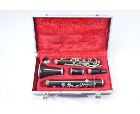 A cased French Console five piece clarinet 