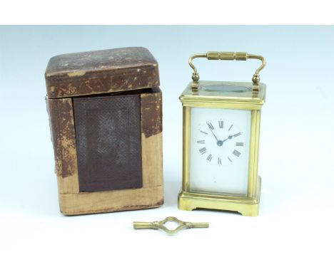 [Great War] An George V brass carriage clock in leather travel case, the top of the corniche clock case bearing a dedication: