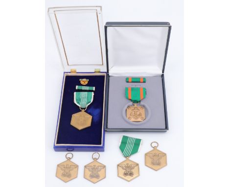 A US Army Commendation Medal together with a Navy and Marine Corps Achievement Medal, cased, and four further examples of the