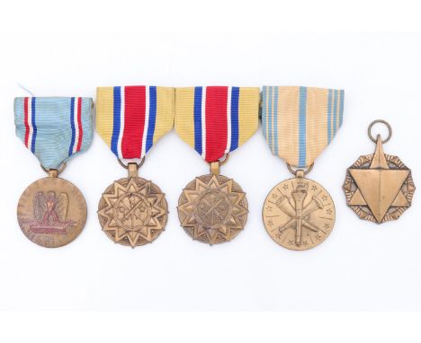 A US Combat Readiness medal - Air Force, an Air Force Good Conduct Medal, two Army Reserve Components Achievement Medals, and