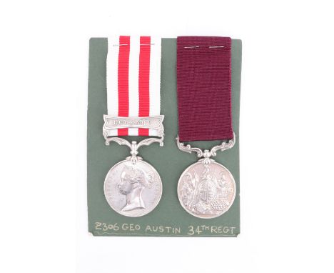 An Indian Mutiny Medal with Lucknow clasp, and Army Long Service and Good Conduct Medal impressed to 2306 Geo Austin, 34th Fo