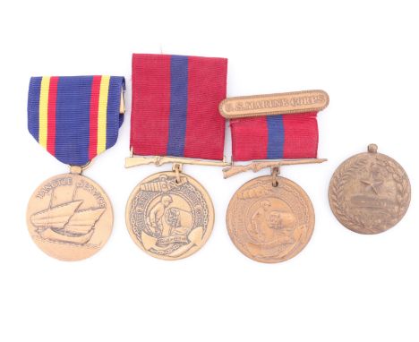 A US Marine Corps Yangtze Service Medal, two Marine Corps Good Conduct Medals and an Army Good Conduct Medal