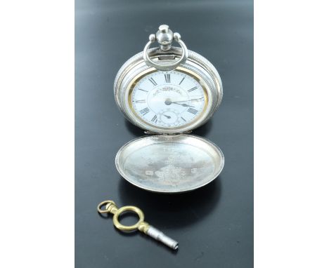 A silver pocket watch for the Ottoman market, movement signed by J. Dent London, in an engine turned case having a vacant car