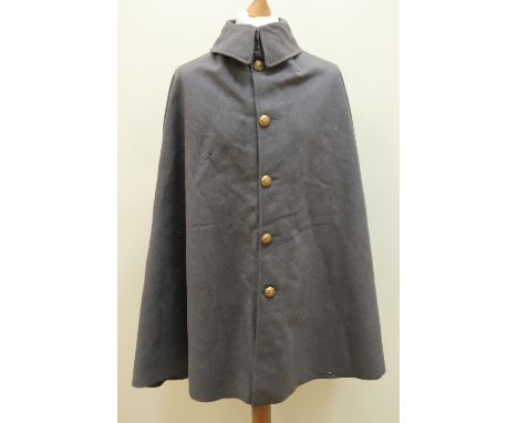 An Edwardian army general's cape, bearing a label with the inscribed name Major General J S Ewart and dated 1906. [Joined Que