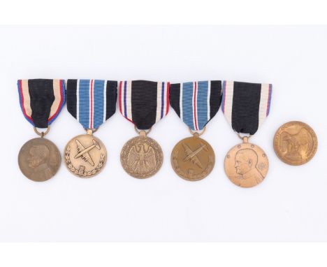 Three US Army of Occupation of Germany Medals, a Prisoner of War Medal and two Humane Action Medals