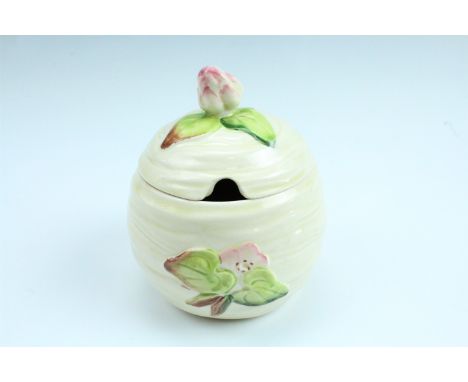 A Clarice Cliff preserve jar, 11 cm