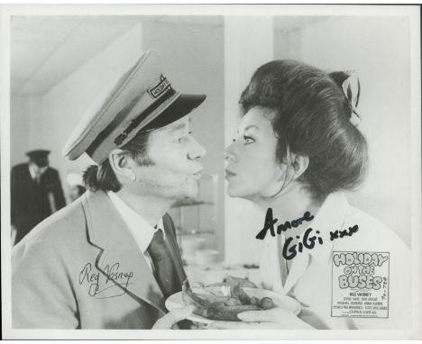 Holiday on the Buses, a 10x8 b/w film photo. Signed by Reg Varney who played Stan Butler and Gigi Gatti as Maria. Good condit