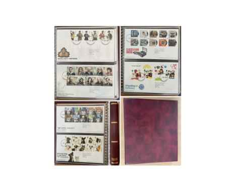 Stanley Gibbons First Day Covers Album Red with approx. 60 FDCs from 2009 Royal Navy Uniforms to 2014 Classic Children's TV. 