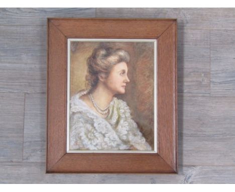 An oak framed watercolour "Portrait of a Lady" 30 x 23.5cm signed with monogram