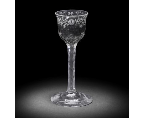 A fine engraved facet stem wine glass of Jacobite interest, circa 1765-70The lipped ogee bowl neatly decorated with a band of