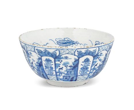 A very large Bristol delftware punch bowl, circa 1740The interior painted in blue with a chinoiserie landscape depicting an o