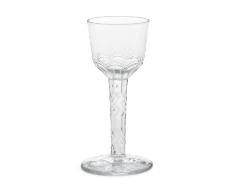 A rare facet stem wine glass, circa 1770-75The ogee bowl cut with basal flutes and trefoil motifs, the stem unusually cut wit
