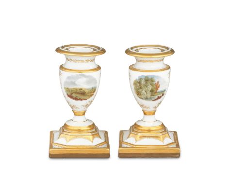 A good pair of Flight, Barr and Barr candlesticks, circa 1815The urn-shaped nozzles with flared rims, finely painted with rur