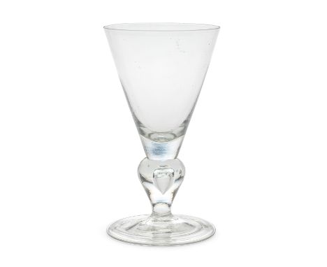 An early heavy baluster goblet, circa 1700The generous conical bowl set on a wide inverted baluster stem enclosing a tear, ov