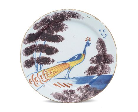 A Bristol delftware 'Farmyard' plate, circa 1720-30Of unusually small size, the plate of 'pancake' profile without a footrim,